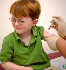 young boy getting vaccine